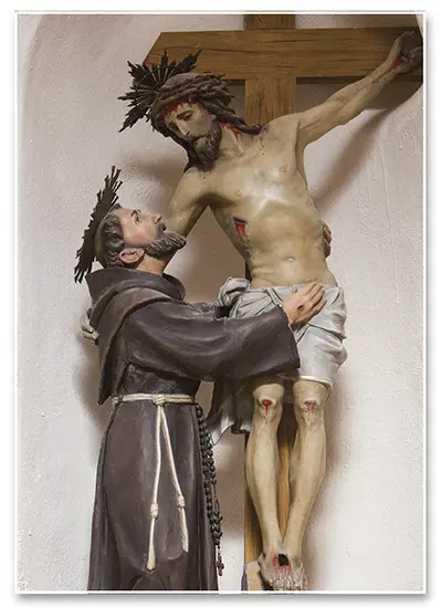 Christ crucified and St. Francis of Assisi, symbolizing participation in Christ's redemptive suffering.